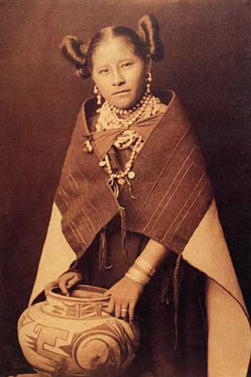 Hopi woman with a traditional pot and traditional clothing